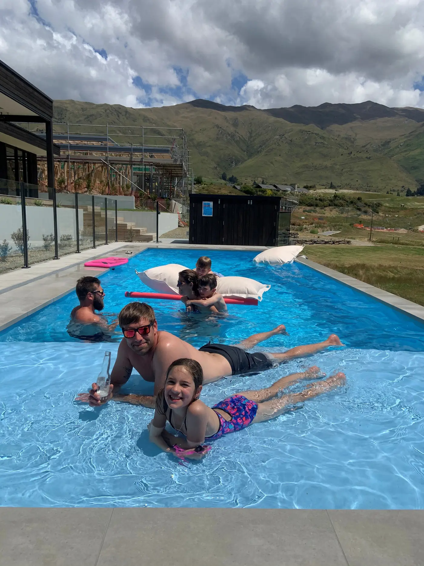 A family enjoying their finished pool